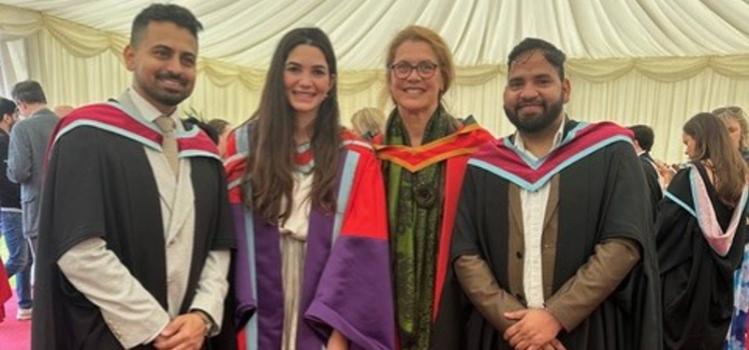 Dr A Saleh at graduation with two masters graduates